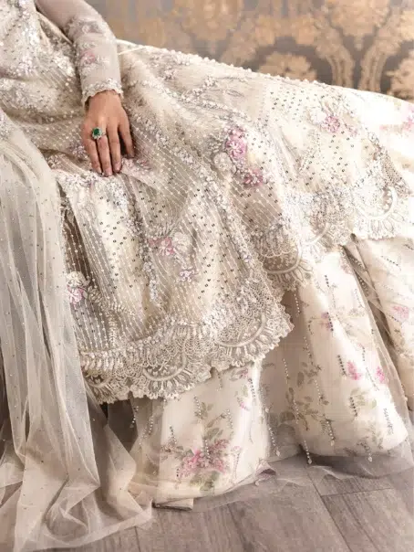 A Swarovski Affair by Crimson D-04 -3 in ivory color showcasing the encrusted net dupatta with handworked motifs.