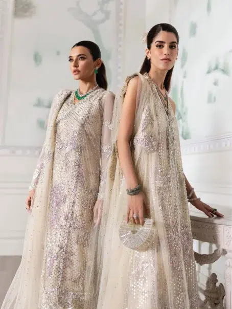 A Swarovski Affair by Crimson D-04 -4 in ivory color presenting the complete set with shirt, sharara, and dupatta.