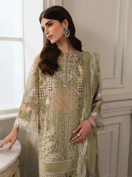 Sparkle Cascade by Crimson D-03 -3 in pistachio color, displaying the detailed embroidered sleeves with crystal drop accents.