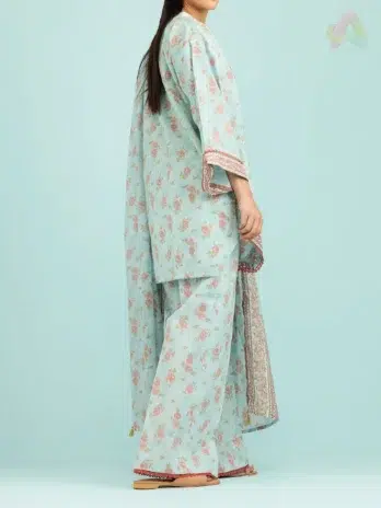 "Model wearing Orient Lawn Collection D-03 in Sea Mist color, styled in an airy outdoor environment.