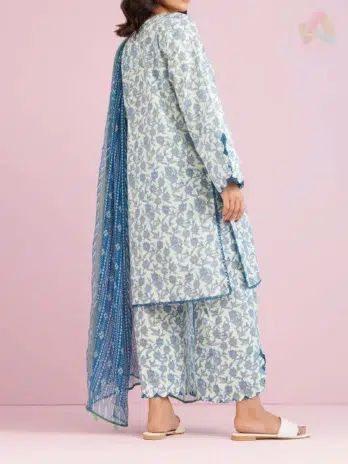 "Model styled in Orient Lawn Collection D-04 in Light Blue color posing in a serene setting."
