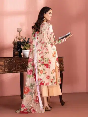 "Model wearing Banafsha by Gulljee D-02 in Pinkesh Tan color in a serene outdoor setting."