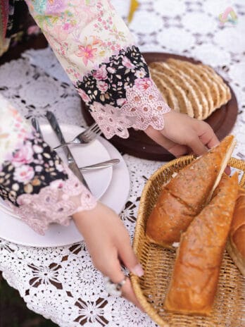 Close-up of the embroidery on Rajbari Schiffli Printkari D-01 highlighting detailed front and sleeve work
