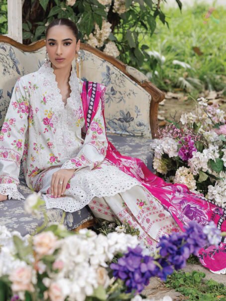 Close-up of Schiffli embroidery and lace details on neckline and sleeves