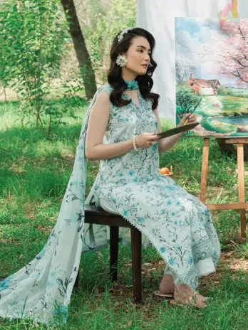 Model wearing Cinq Summer Cocktail Fioren 3-piece lawn suit with chiffon dupatta, ideal for Eid and festive wear from Cinq Eid collection 2025