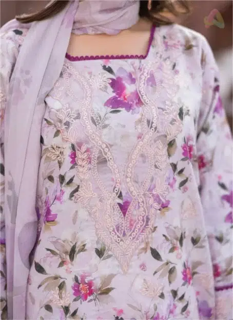 Close-up of Sanam Saeed by Puri Fabrics D-04 embroidery and print work on lawn fabric, capturing thread finesse and seasonal hues.