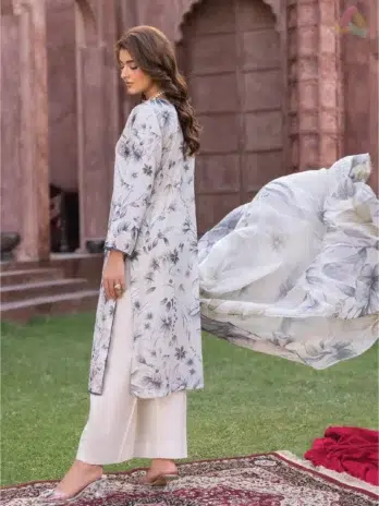 Model displays the digital printed back of Sanam Saeed by Puri Fabrics D-06 in a traditional yet modern setting.