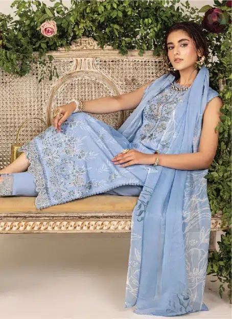 Model wearing Sofia By Sanam Saeed D-03 lawn suit with chiffon dupatta, part of the Puri Fabrics summer collection and Eid 2025 line.