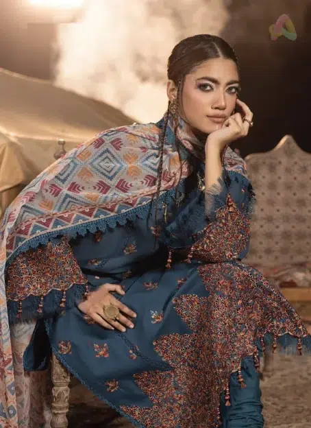 Close-up of embroidery on neckline and sleeves highlighting multi-thread schiffli craftsmanship on breathable lawn fabric by Adan’s Libas