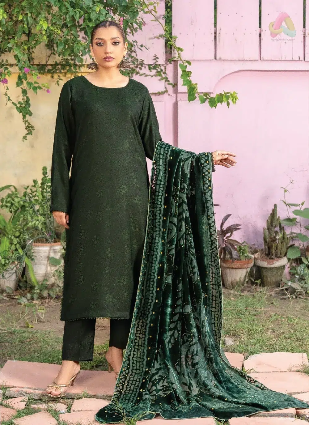 Anarkali By Mahay A-02 1 Anarkali By Mahay A-02 front view showcasing fancy zarri jacquard peach shirt, plachi shawl, and plain trouser in elegant winter style.