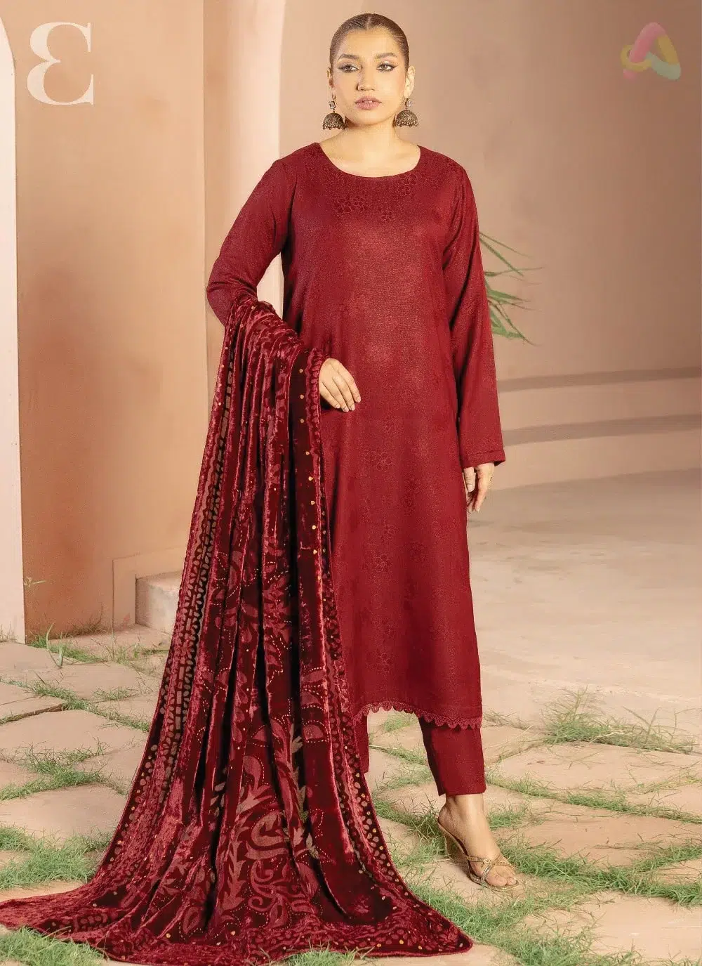 Anarkali By Mahay A-03 1 Anarkali By Mahay A-03 front view showcasing fancy zarri jacquard peach shirt, plachi shawl, and plain trouser in elegant winter fashion.