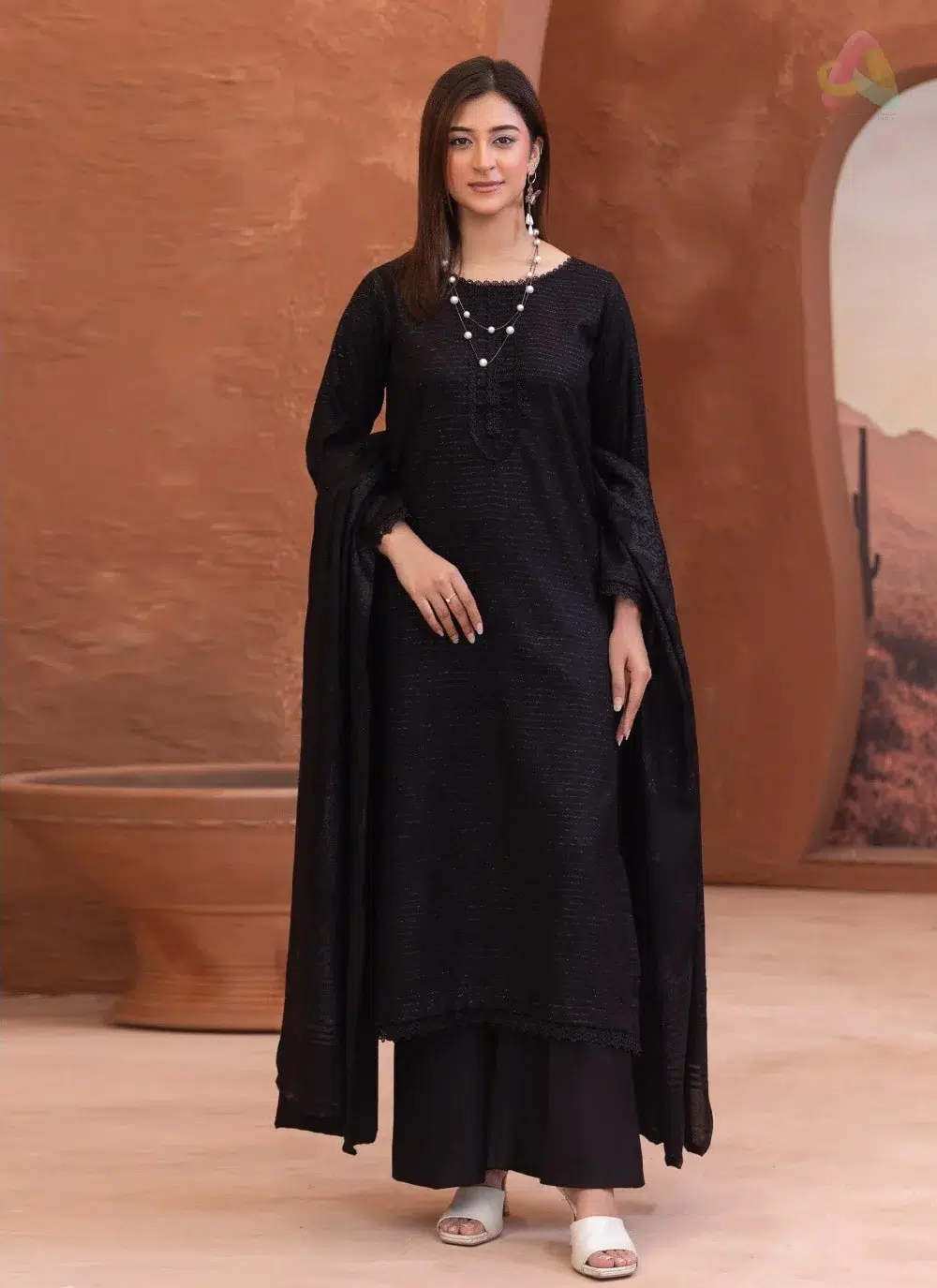 Rang E Mehfil By Mahay Vol 2 D-05 1 Rang E Mehfil By Mahay Vol 2 D-05 front view showing elegant fancy peach shirt with velvet jacquard shawl and plain trouser.